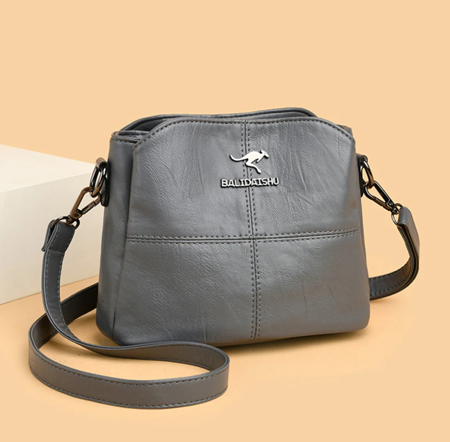 Borsa a mano in pelle nera, versatile, stile classico e raffinato.