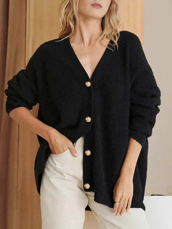 Cardigan donna elegante grigio mélange con bottoni dorati, vestibilità morbida, ideale per stile casual autunnale.