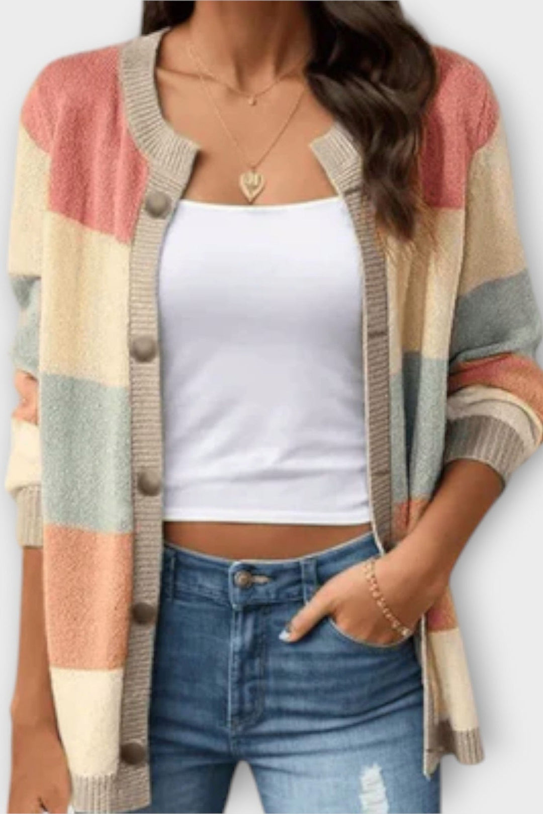 Cardigan donna a blocchi di colore, morbido e confortevole, con bottoni frontali. Perfetto per moda autunno/inverno.