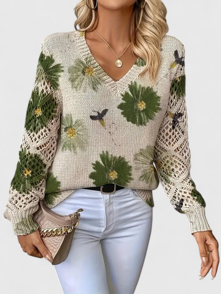 Cardigan donna confortevole con elegante fantasia floreale e maniche traforate, perfetto per un look chic.