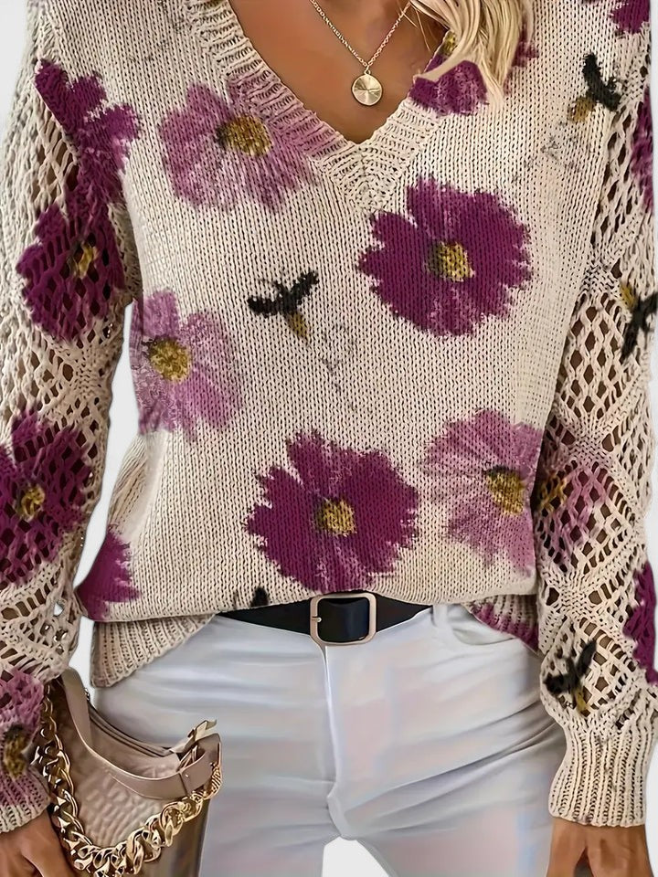 Cardigan donna con scollo a V, fantasia floreale e raffinate maniche traforate, ideale per primavera.