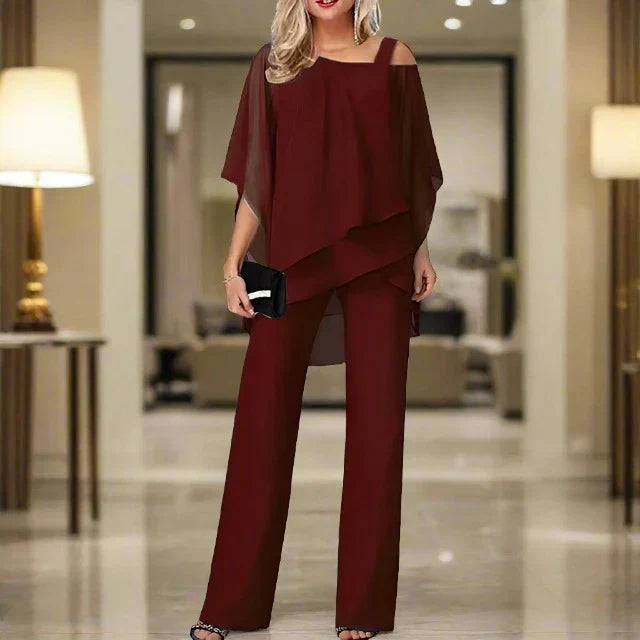 Completo cerimonia donna: blusa monospalla elegante e pantaloni fluidi. Outfit due pezzi per un look raffinato.