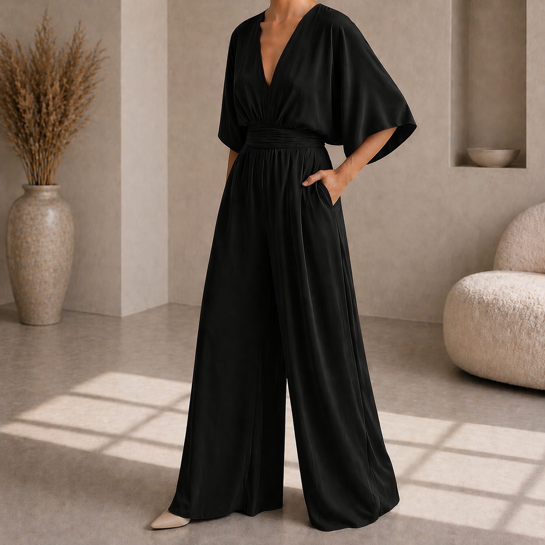 Tuta da donna elegante a gamba ampia, ideale per un look fluido e chic, perfetto per eventi speciali.