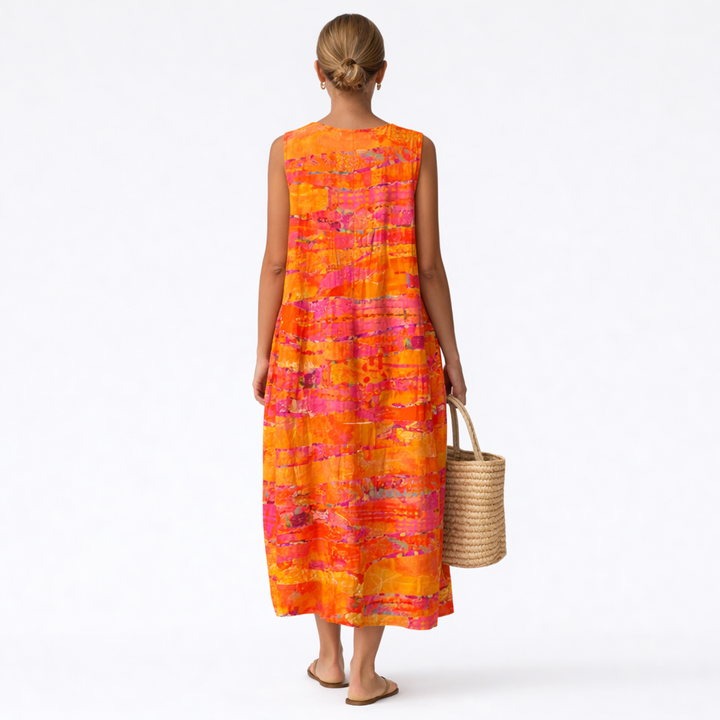 Abito estivo smanicato midi con stampa astratta solare unica, confortevole per il look casual di ogni donna.