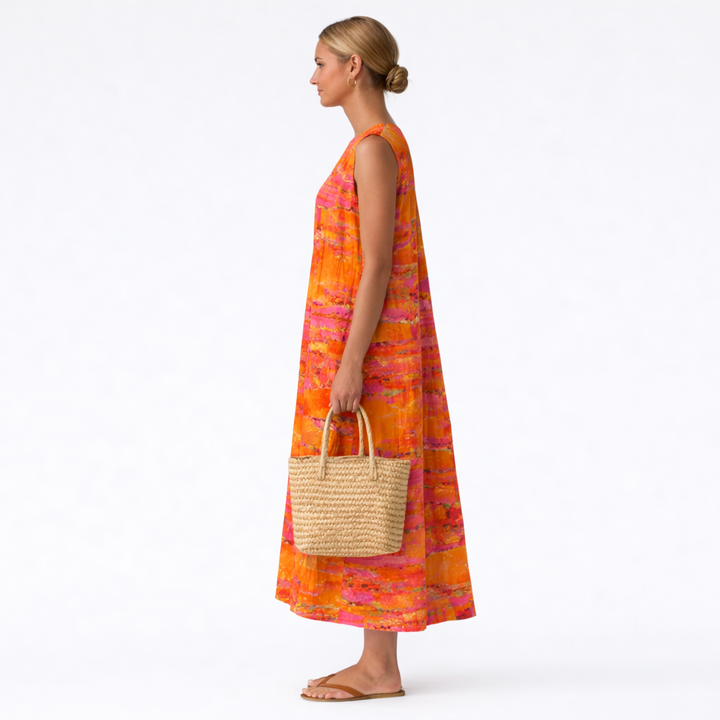 Vestito midi donna smanicato con audace stampa astratta solare, trendy e versatile per primavera ed estate.