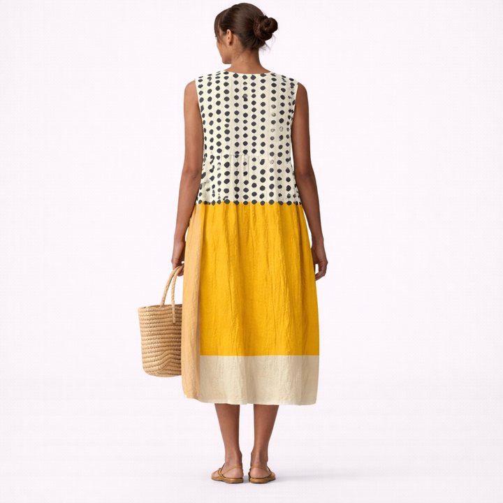 Abito midi donna in cotone viscosa, con fantasia a pois e blocchi di colore, ideale per l'estate e la primavera.