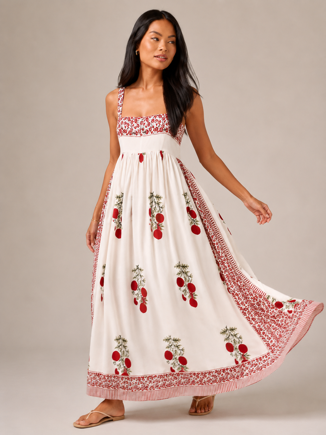 Donna indossa abito maxi boho fluido ed elegante con spalline larghe, ideale per un look estivo chic.