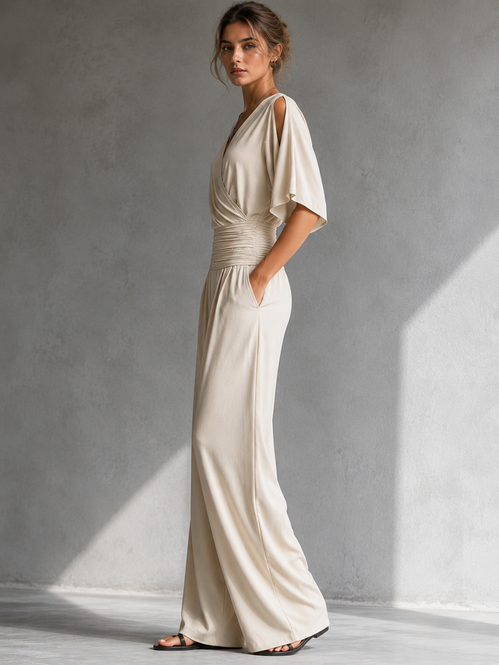 Tuta donna comoda ed elegante, scollo a V incrociato e gamba larga, ideale per eventi e serate speciali.