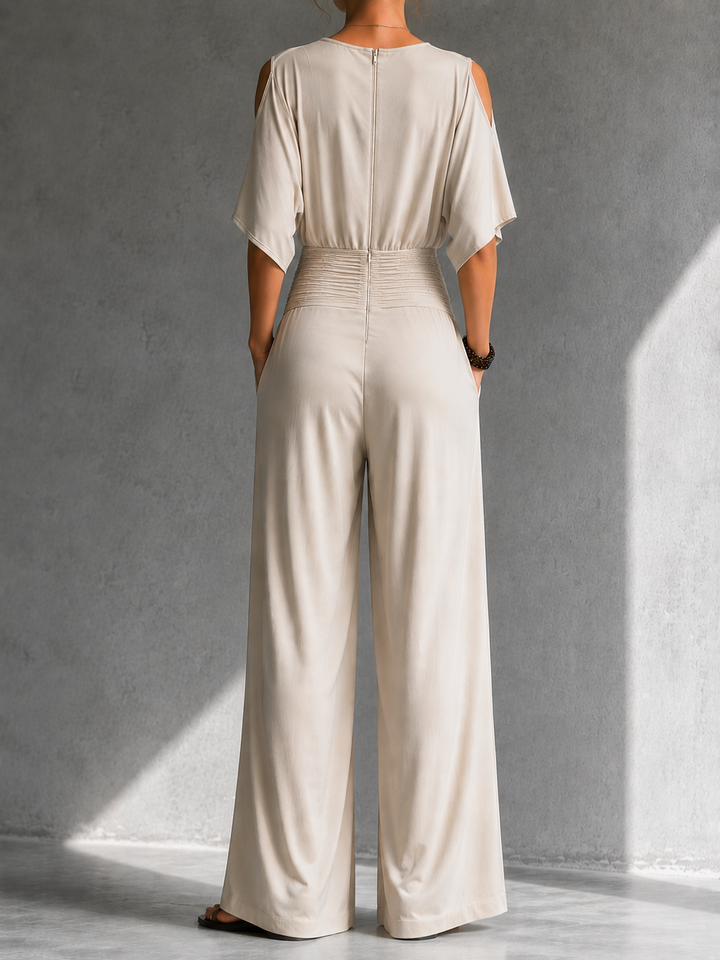 Jumpsuit donna elegante con scollo a V incrociato e pantalone a gamba larga, per un look raffinato.