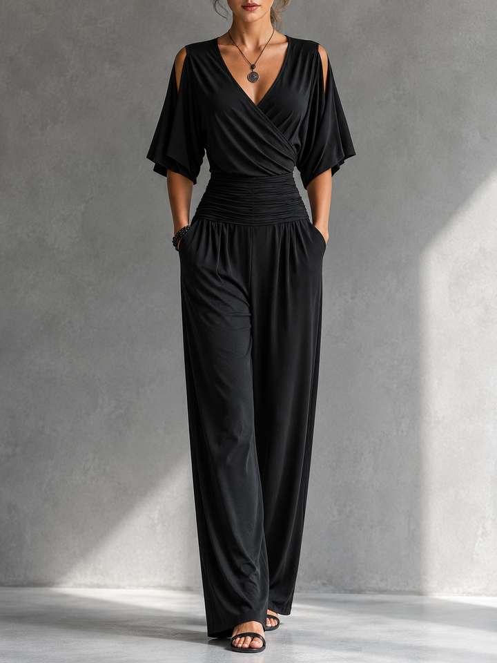 Tuta elegante da donna versatile, con scollo a V incrociato, ideale per eventi speciali e outfit serali.