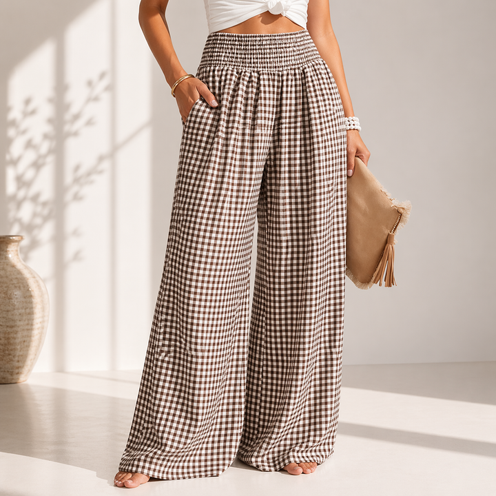 Pantaloni donna primavera estate, gamba larga e vita alta con stampa quadretti. Tessuto fluido per look elegante.