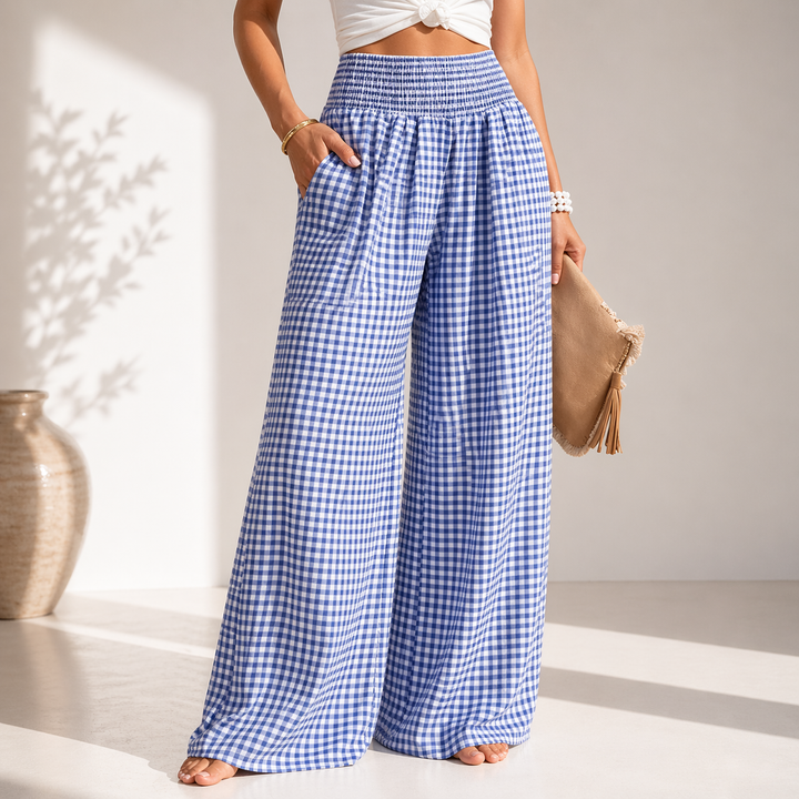 Pantaloni donna a gamba larga con vita alta e stampa quadretti, perfetti per un look casual chic e comodo.