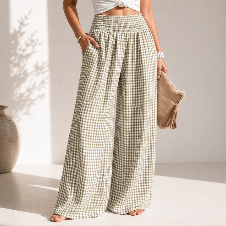 Vista posteriore pantaloni donna a vita alta con gamba larga e quadretti. Vestibilità comoda e stile casual chic.