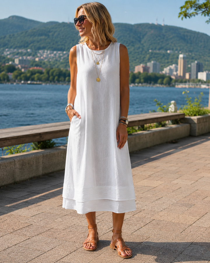 Abito midi donna smanicato con balza, perfetto per un look estivo fresco e casual chic.