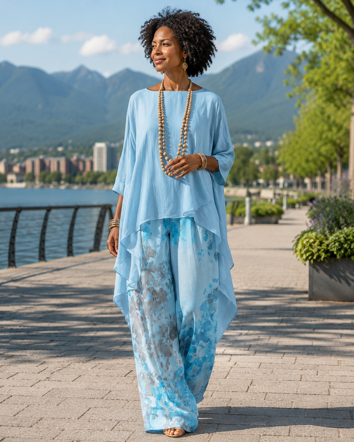 Completo donna boho con blusa asimmetrica e pantaloni floreali per un look estivo casual chic.