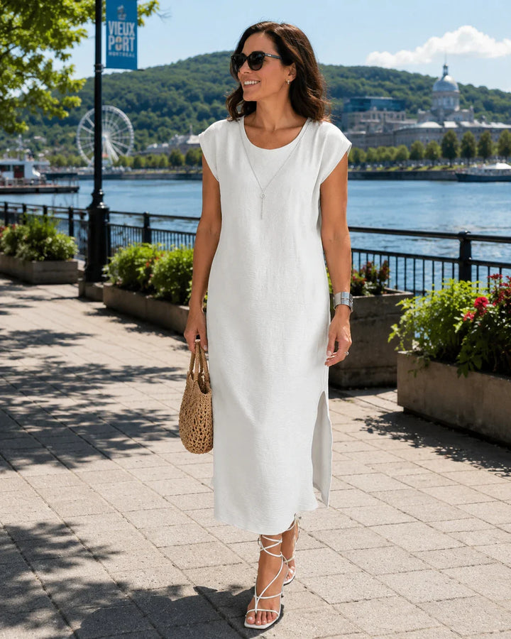 Abito midi donna in micro-crepe con elegante spacco laterale, perfetto per l'eleganza estiva e look quotidiano.