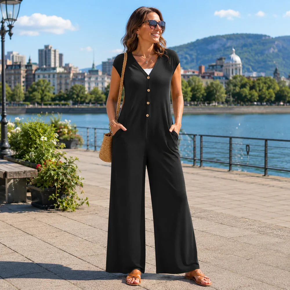 Tuta elegante donna estiva con pantaloni larghi, scollo a V, perfetta per look casual chic.