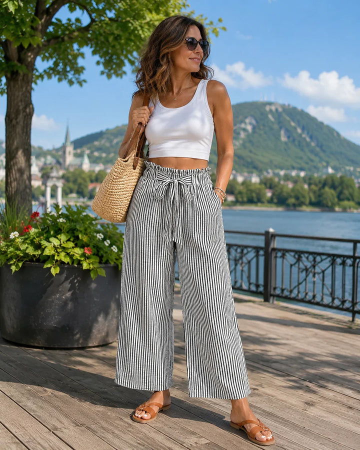 Pantaloni da donna a gamba larga con vita paperbag, perfetti per un look elegante o casual.