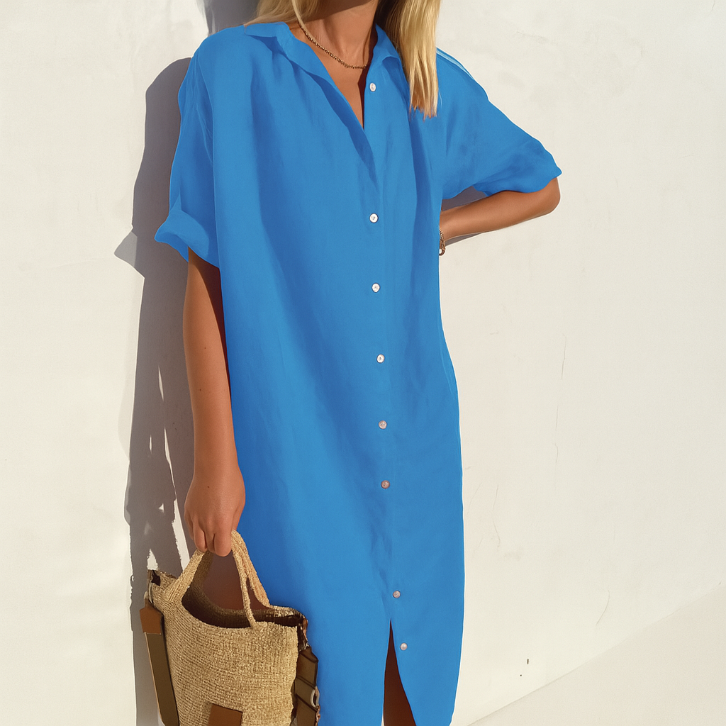 Modello abito camicia donna con bottoni a tutta lunghezza e colletto classico, per uno stile casual chic estivo.