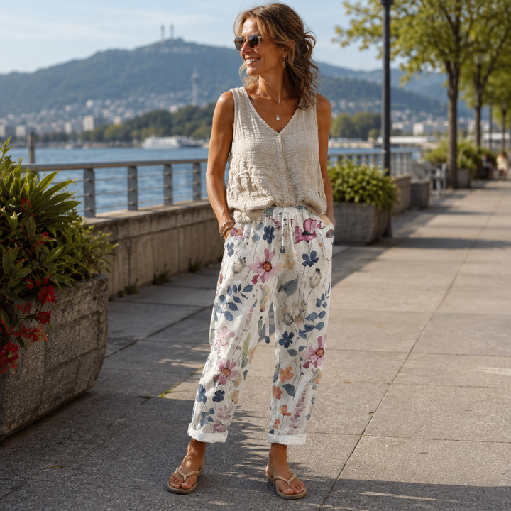 Pantaloni donna estivi floreali, vita regolabile, ampi e leggeri, perfetti per vacanze e spiaggia.