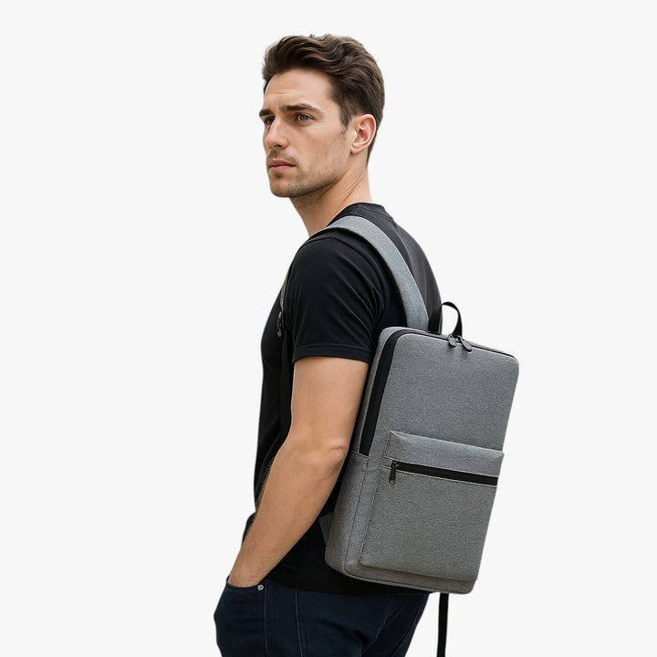 Zaino porta laptop unisex, versatile design grigio/nero, perfetto per lavoro, studio e tempo libero.