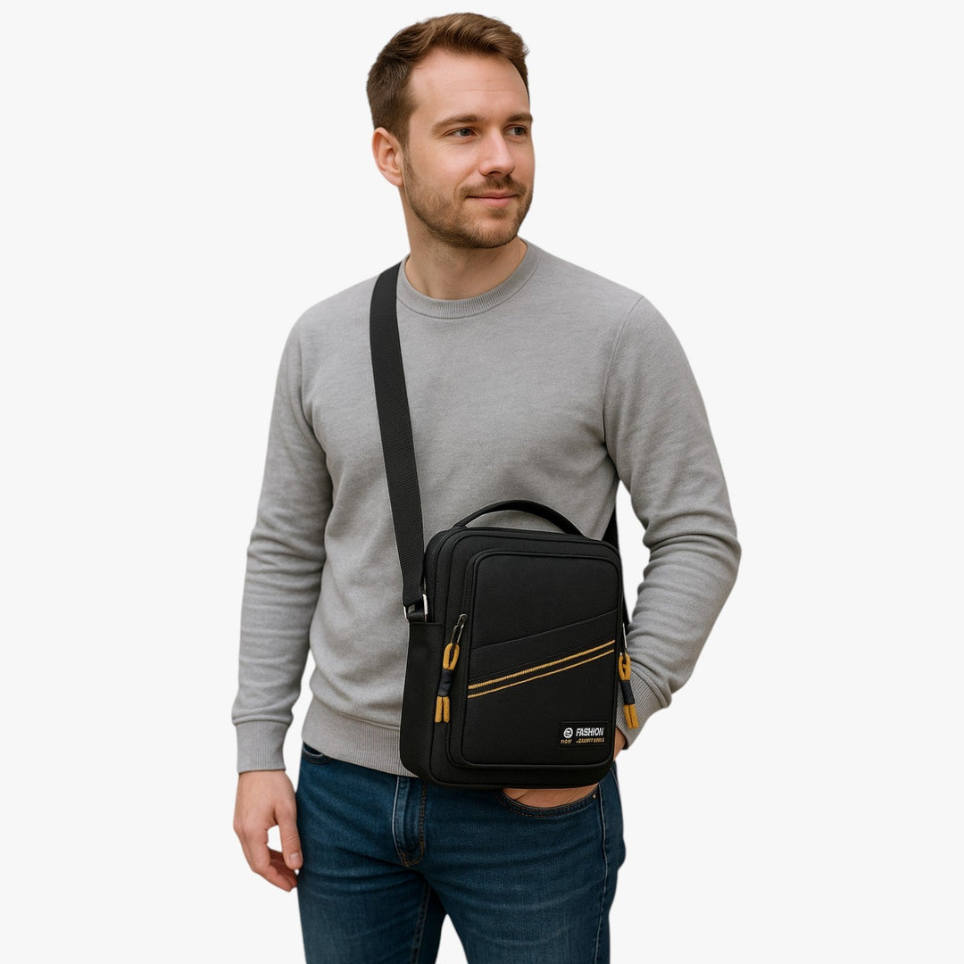 Borsa a tracolla nera da uomo, messenger compatta, accessorio versatile per look casual.