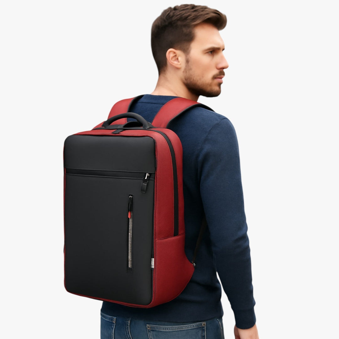 Zaino uomo organizzato per laptop 15.6", disponibile in rosso, blu, grigio e nero, con porta USB.