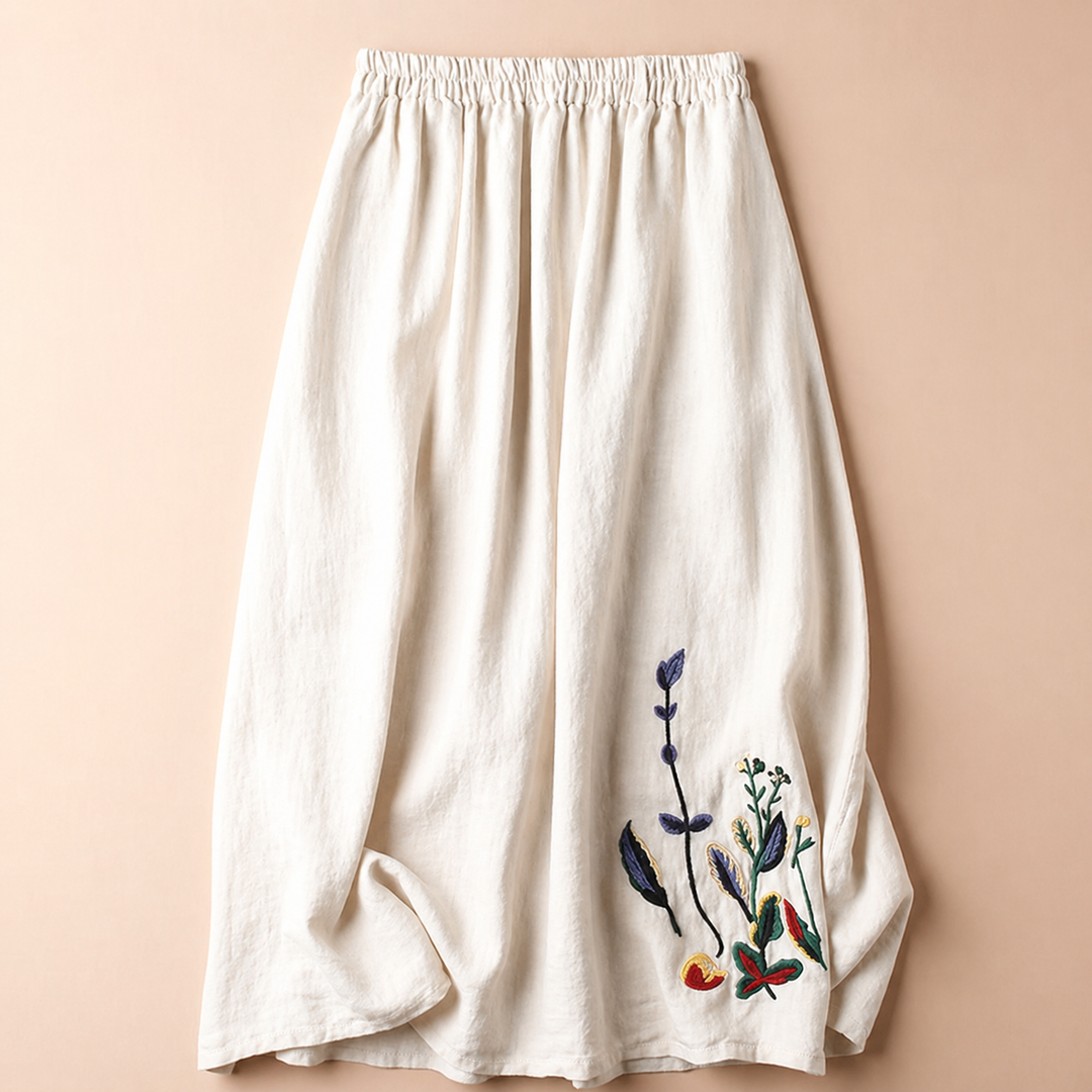 Gonna midi donna elegante con vita elastica, dettagli ricamati e stile casual. Perfetta per primavera/estate.