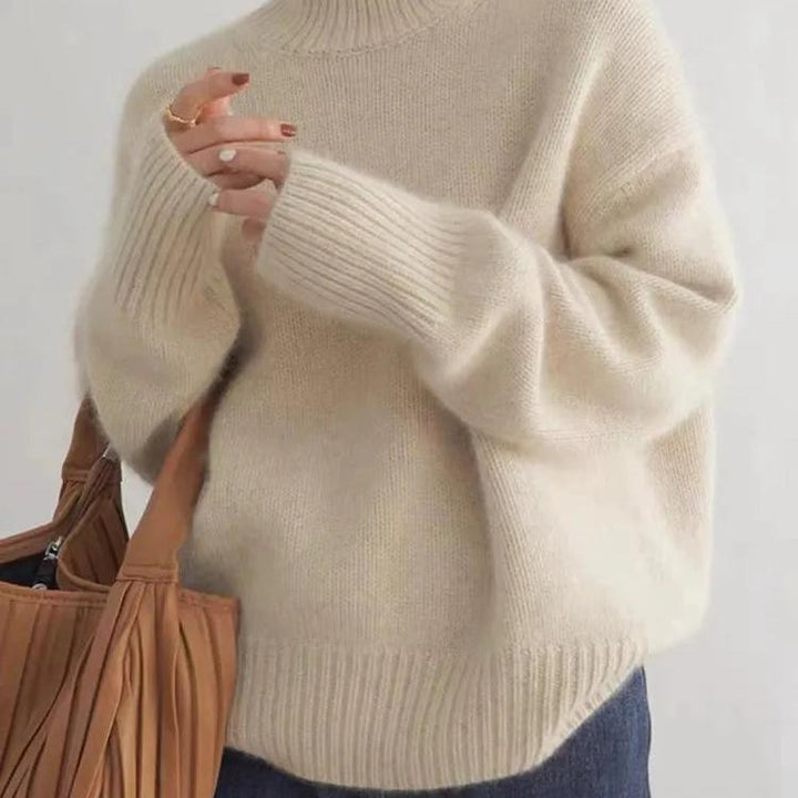 Maglione donna caldo e morbido, con collo alto. Essenziale per la moda invernale, un pullover confortevole ed elegante.