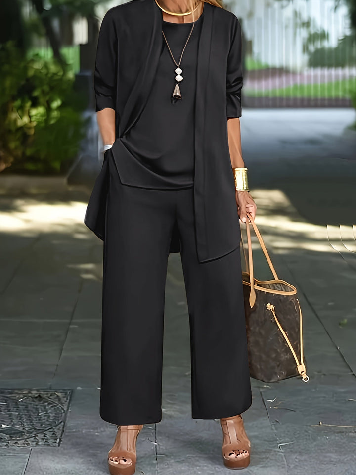 Abbigliamento comodo e stile casual: completo donna con top ampio e pantaloni dritti.