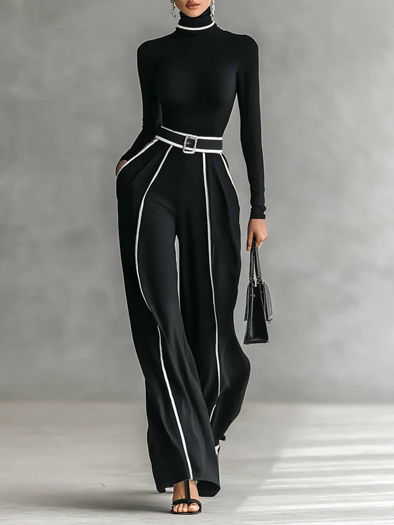 Completo donna elegante due pezzi nero con dolcevita e pantaloni a gamba larga. Perfetto per outfit chic autunno inverno.