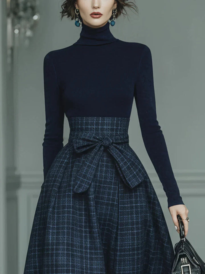 Coordinato donna casual chic: dolcevita morbido e gonna a quadri, ideale per look eleganti e alla moda.