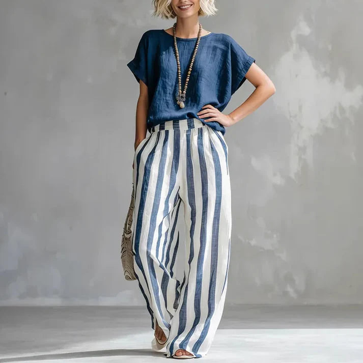 Due pezzi moda donna: top ampio e pantalone a righe verticali vita alta. Perfetto per la primavera estate.