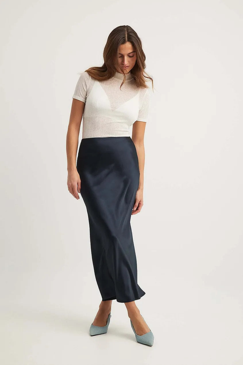 Due pezzi donna bianco, vita alta, linea fluida, perfetto per un look casual o formale raffinato.