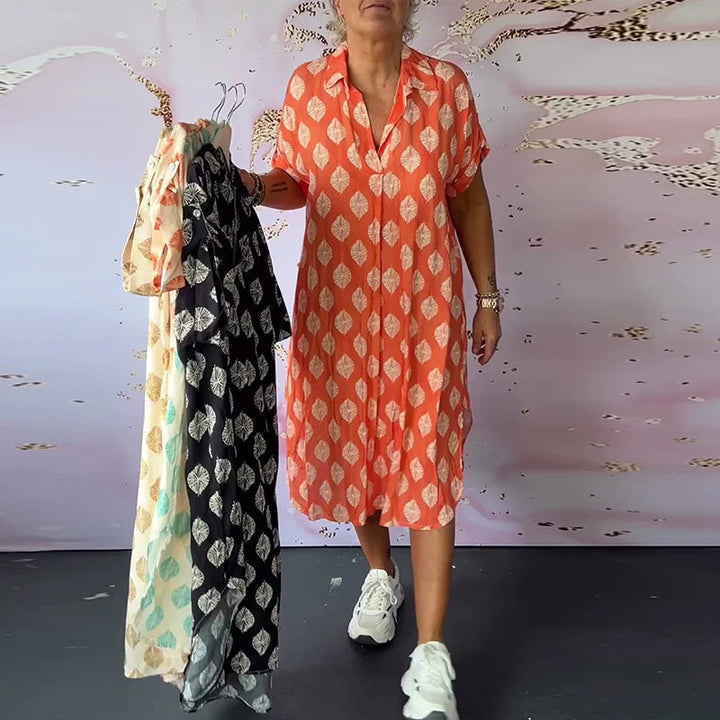 Abito estivo donna midi con scollo a V, comodo e versatile. Disponibile in varie taglie per un'estate alla moda.
