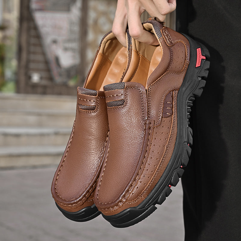 Stivali uomo slip-on neri e arancio per massimo comfort, con supporto arco e suola antiscivolo.