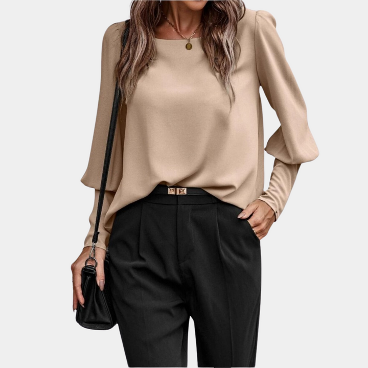 Camicetta da donna moderna, maniche lunghe a palloncino. Top femminile versatile per primavera, stile elegante/casual.