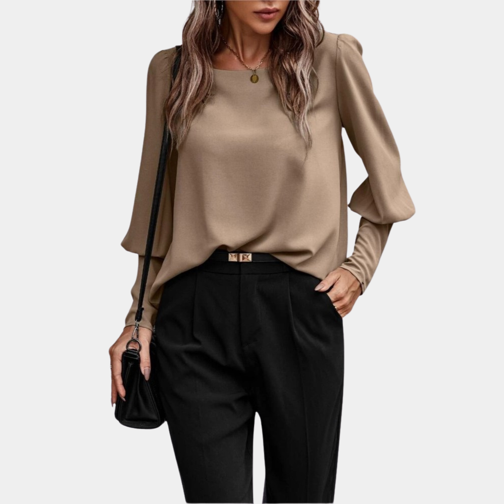Blusa donna con maniche a palloncino e design moderno. Camicetta femminile elegante, perfetta per la primavera.