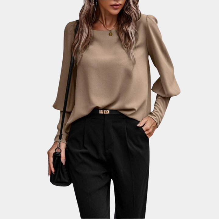 Blusa donna con maniche a palloncino e design moderno. Camicetta femminile elegante, perfetta per la primavera.