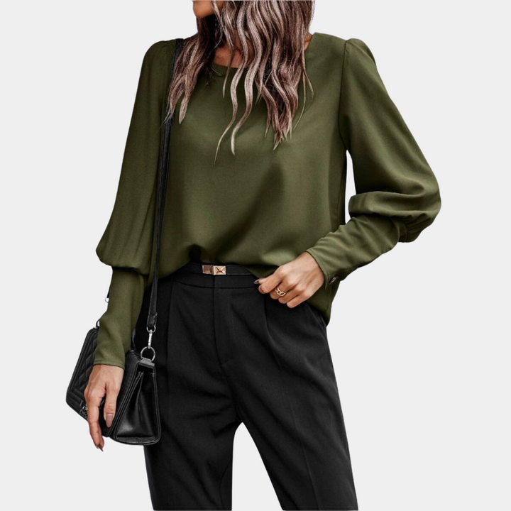 Blusa elegante da donna con maniche a palloncino, perfetta per outfit ufficio o stile casual. Moda femminile moderna.
