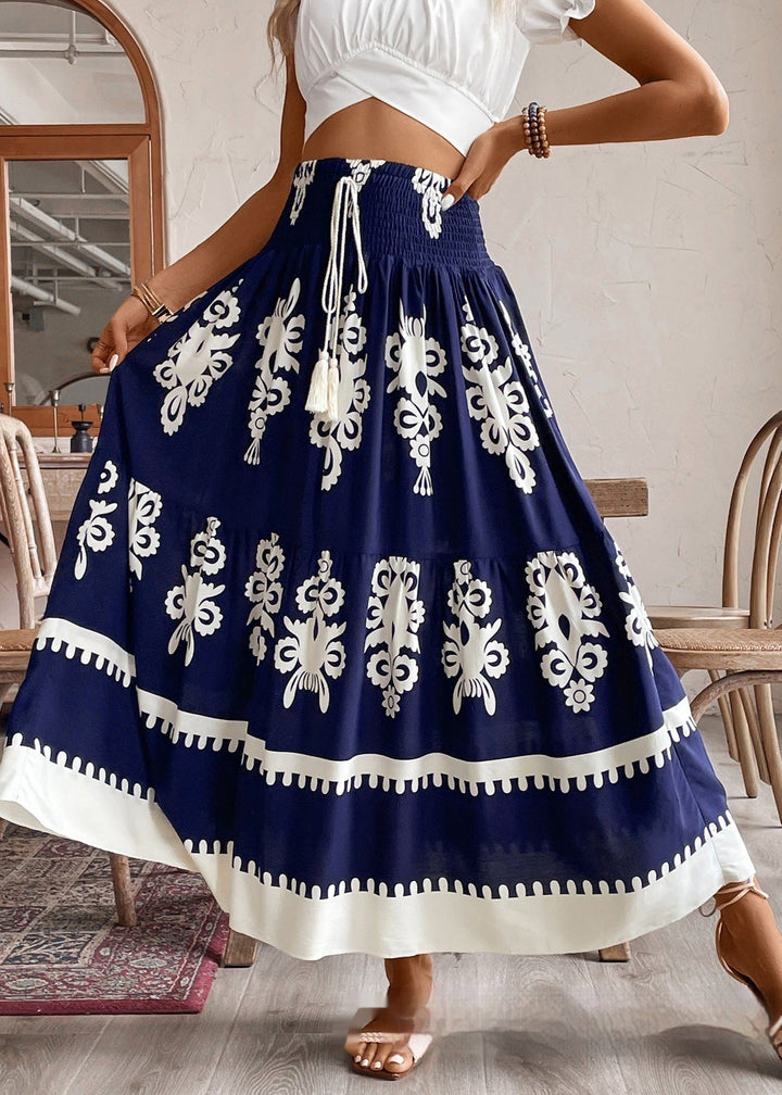 Gonna lunga estiva donna con stampa geometrica e vita arricciata, perfetta per un look fluido e casual da vacanza.