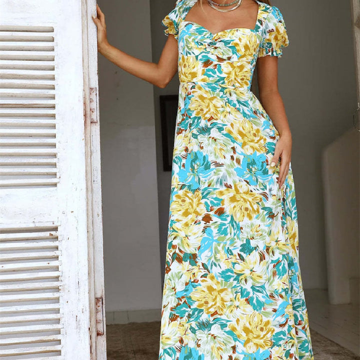 Abito lungo floreale verde con scollo quadrato, ideale come abito da giorno o da sera, comodo e trendy per l'estate donna.