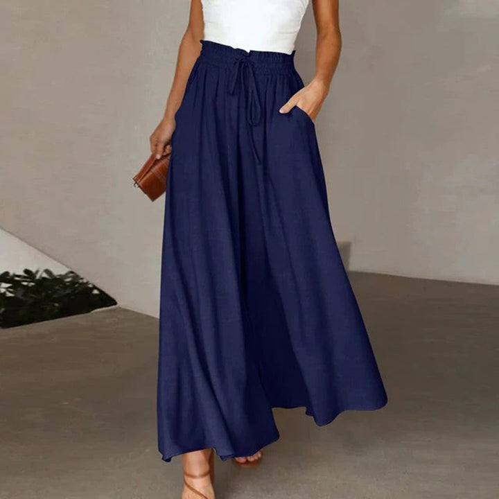 Pantaloni palazzo donna fluidi con coulisse, vita alta e gamba larga per massimo comfort e stile estivo.