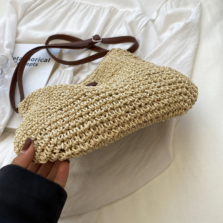 Borsa a tracolla donna in paglia intrecciata, stile estivo casual perfetto per la spiaggia.