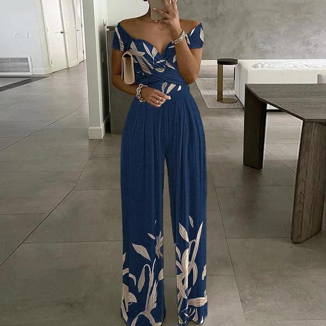 Elegante tuta donna off shoulder stampata, ideale per outfit casual chic o serate estive.