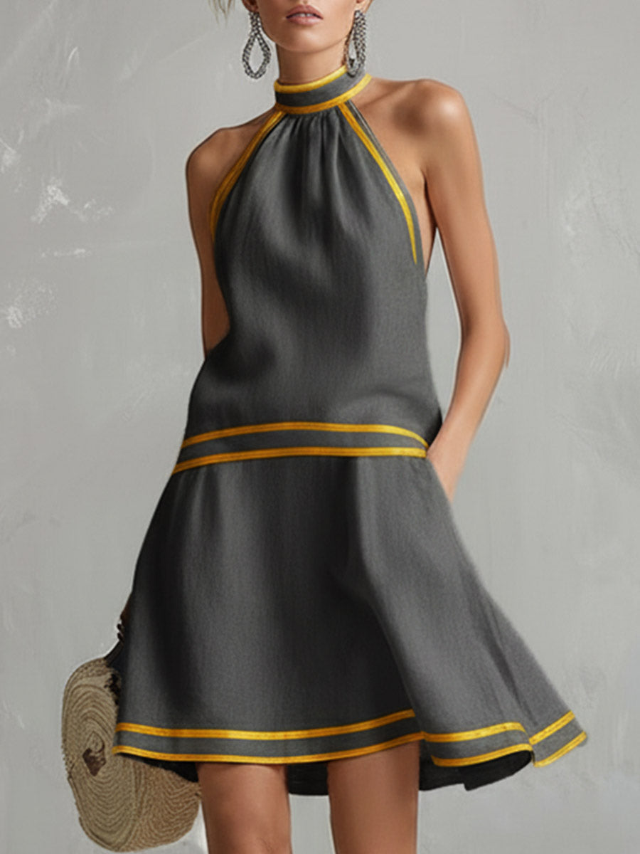 Elegante mini abito donna halter senza maniche, gonna svasata. Perfetto per serate estive o eventi speciali.