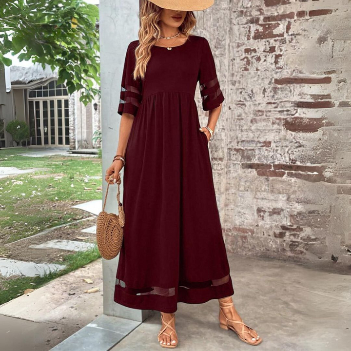 Vestito lungo svasato da donna per sera, design elegante che cattura l'attenzione.