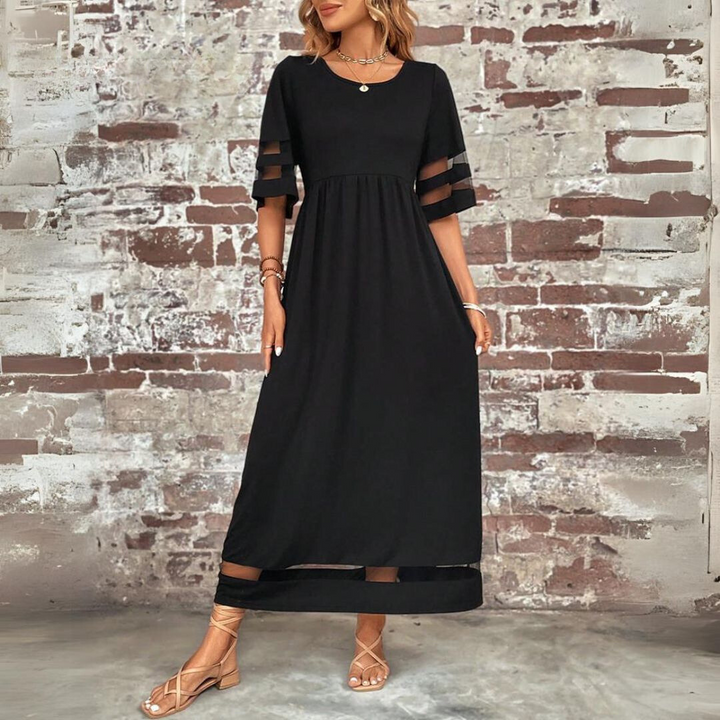 Raffinato vestito da sera svasato per donna, che esalta la silhouette con grazia.