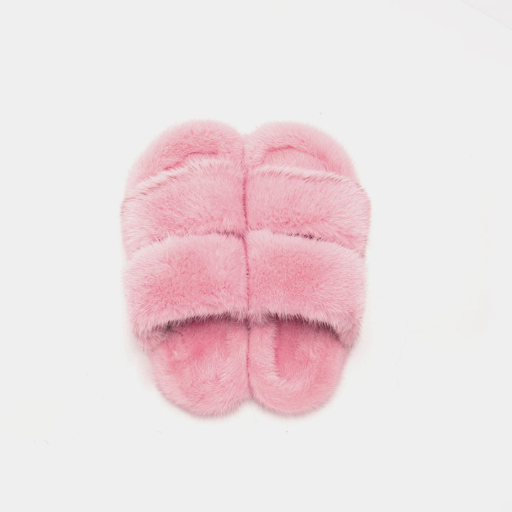 Pantofole donna rosa con fasce in visone morbido. Offrono comfort e relax, ideali per la casa.