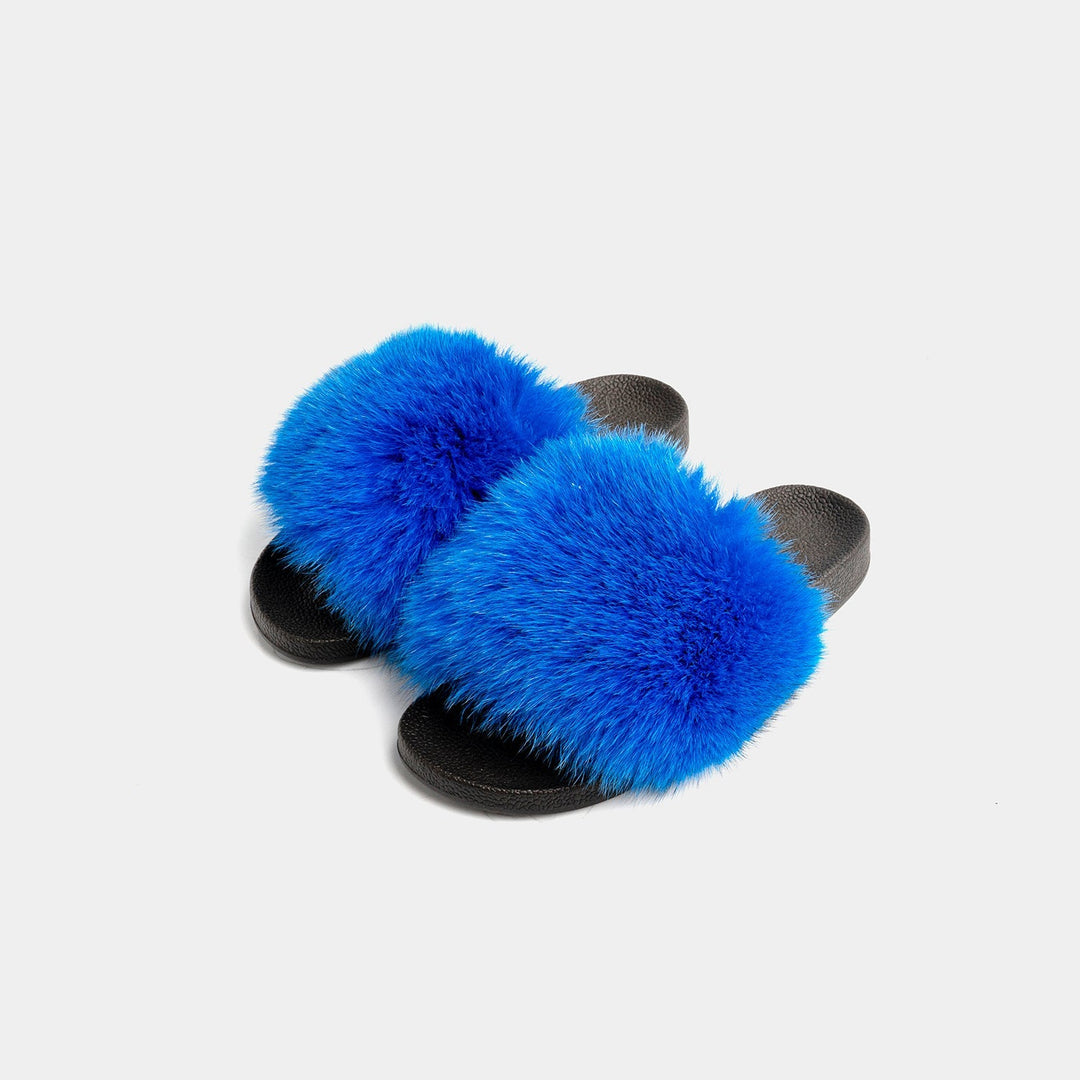 Pantofole donna blu eleganti con fascia in morbida pelliccia, ideali per comfort e relax in casa.